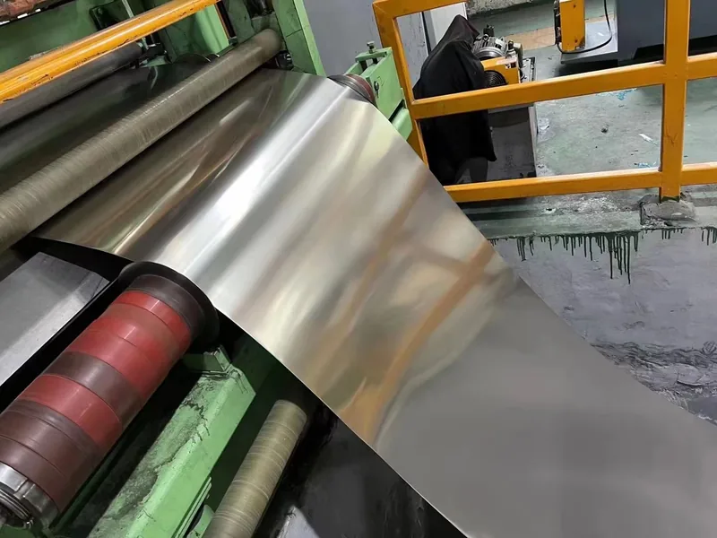 Stainless steel coil being recoiled