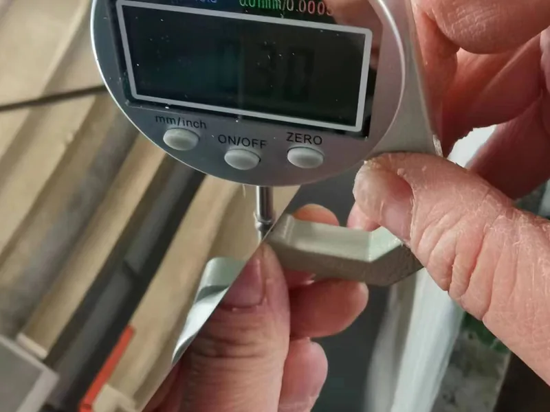 Measuring stainless steel plate thickness with a digital gauge